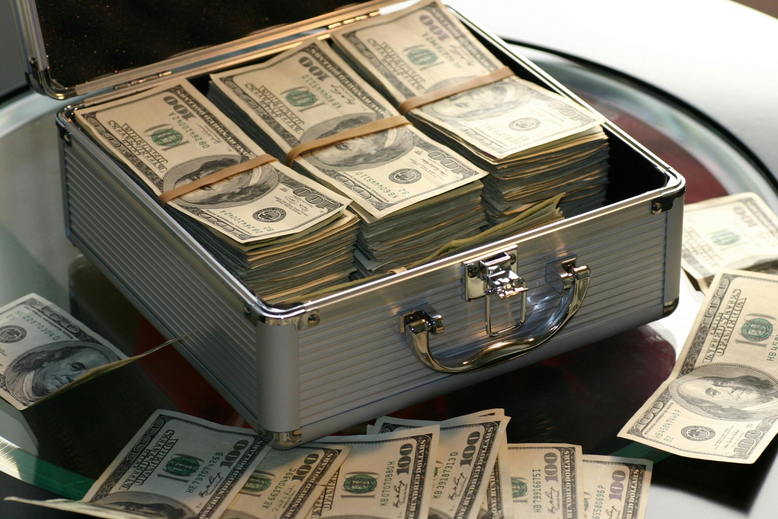 A metal briefcase filled with money.