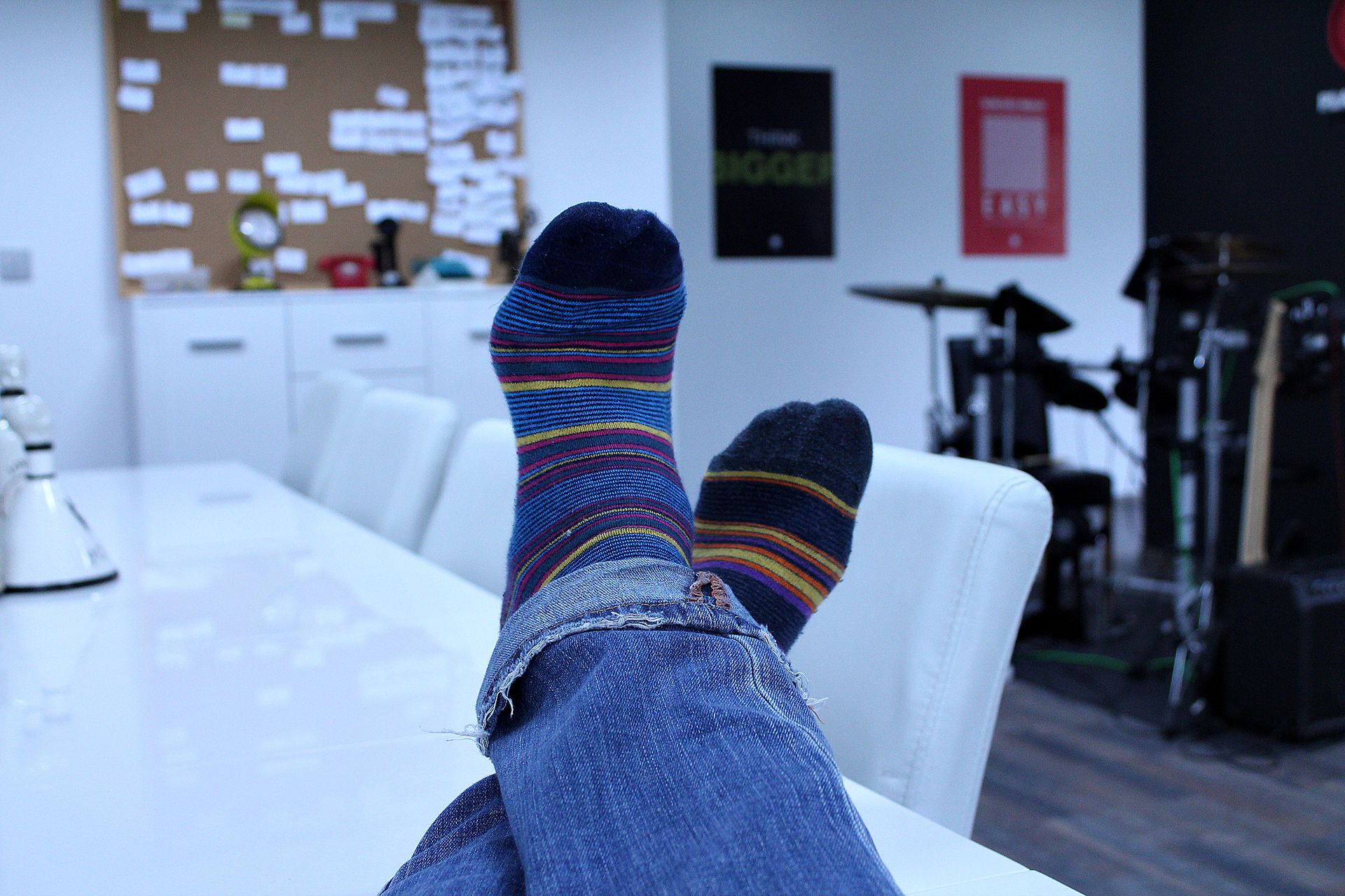 Focused shot of someone's socked feet crossed.